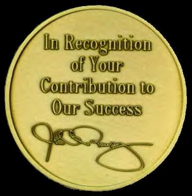 [Access Graphic's medallion in lucite with Ramsey's signature on back]
