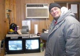 [Sidney Thoms - Romar Transportation Co. security guard Tim Snitko shows off monitors used to watch the property where body parts were found on Friday.]