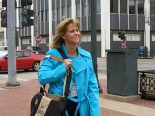 [Drew Peterson's former fiancee Kyle Piry walks back to her vehicle after testifying before a Will County grand jury on Thursday in Joliet]